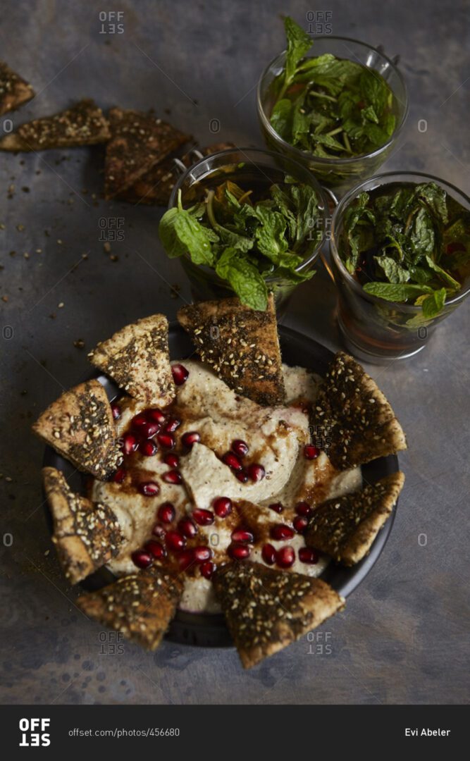 A bowl of food with some crackers and yogurt