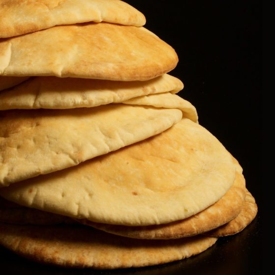 A stack of pita bread on top of each other.