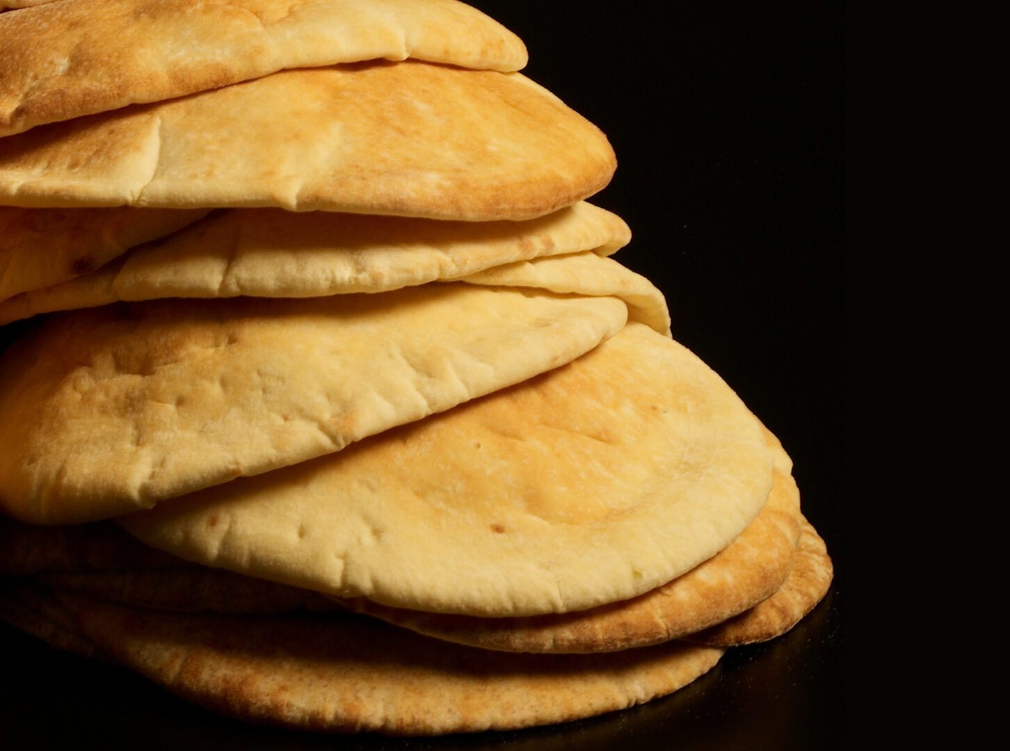 A stack of pita bread on top of each other.